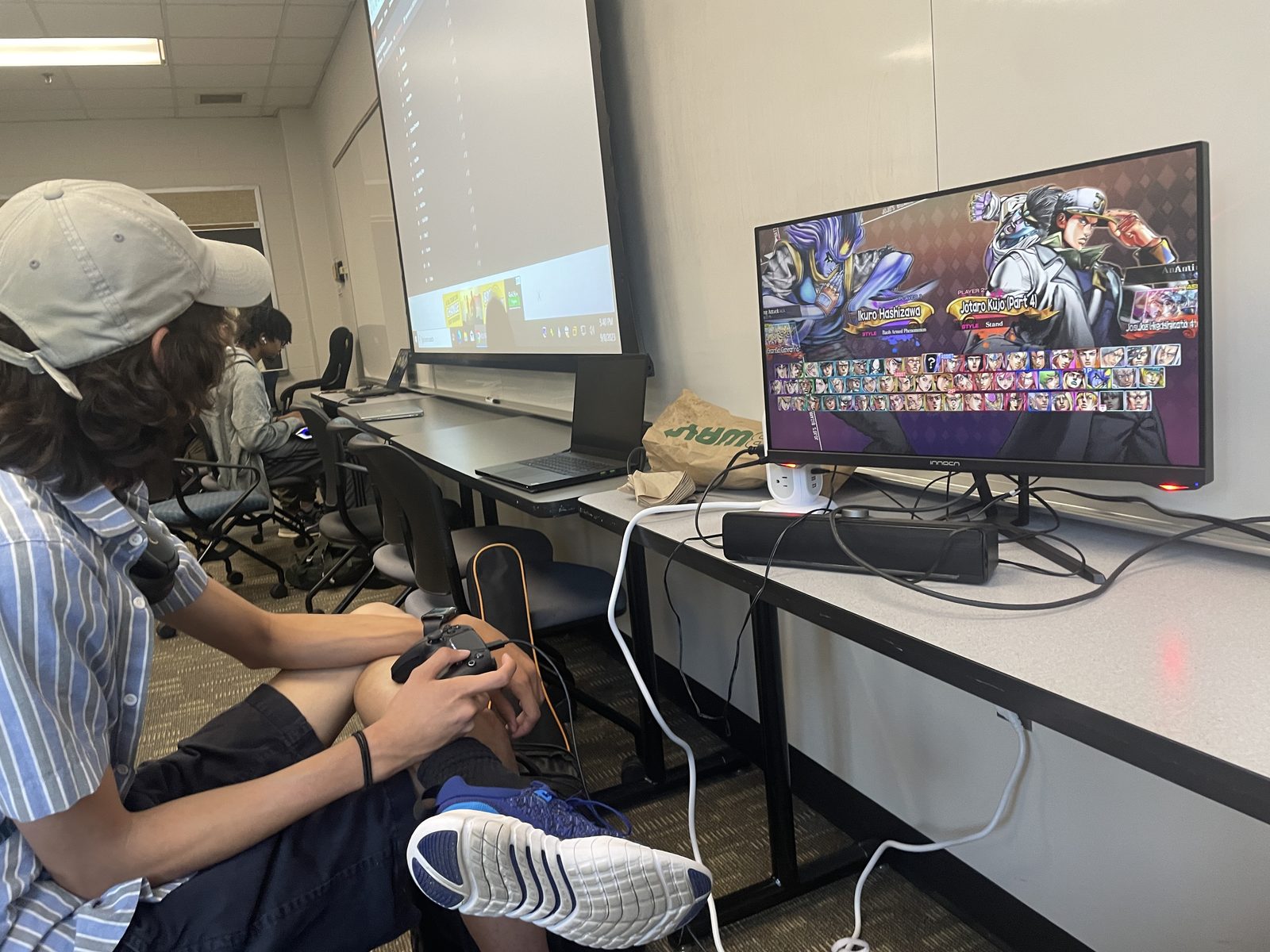 A gamer playing a fighting game